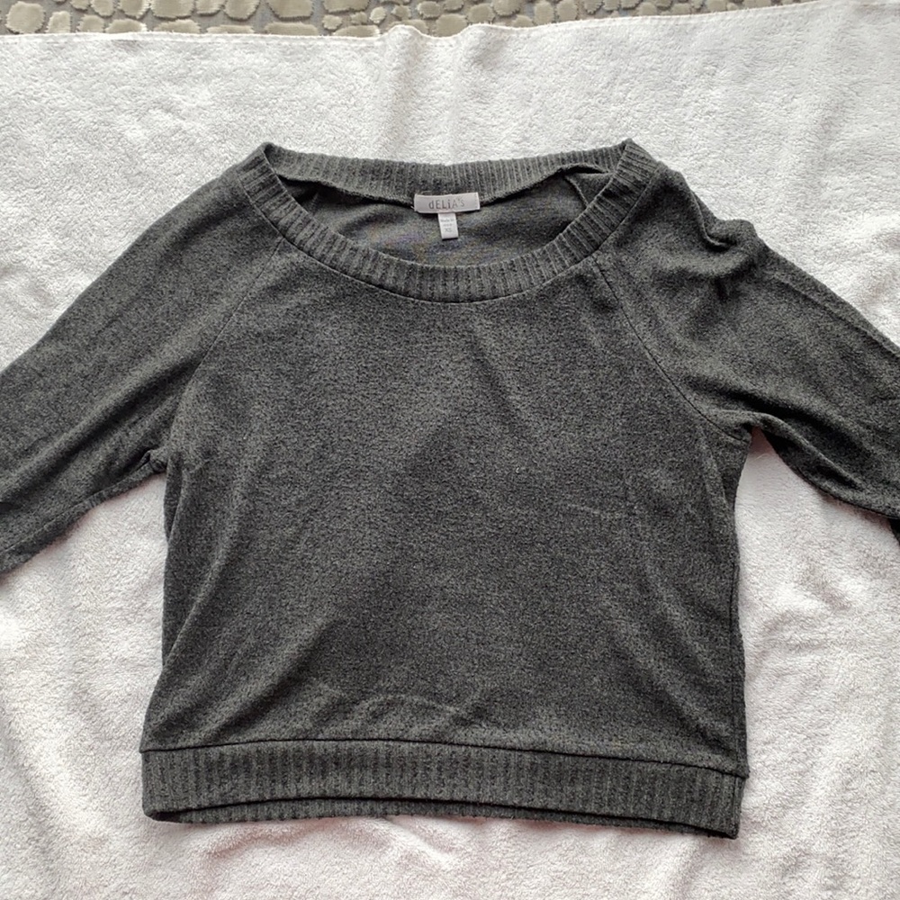 delia’s gray sweater